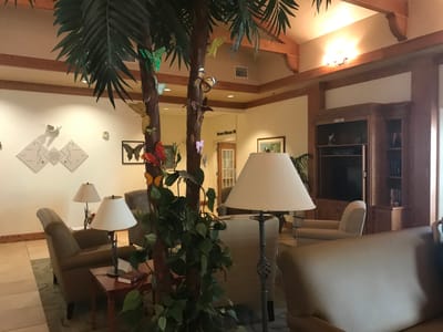 Interior view of a cozy common area with seating and decor
