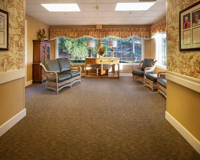 Bright common area with comfortable seating and large windows