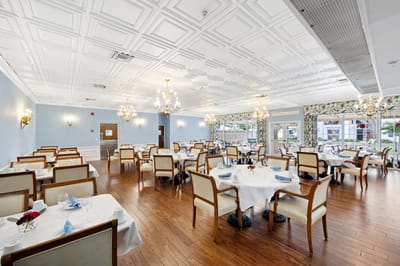 Bright dining room with elegantly set tables
