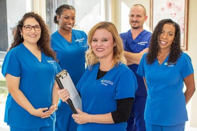 Healthcare staff smiling in a well-lit environment