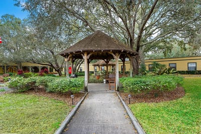 Pathway leading to a gazebo in a landscaped area