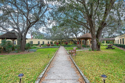 Scenic outdoor garden area with walking paths and seating