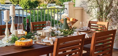 A beautifully set dining table on a patio