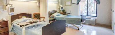 Interior view of a resident room with two beds