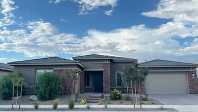 Exterior view of a senior living facility with landscaping