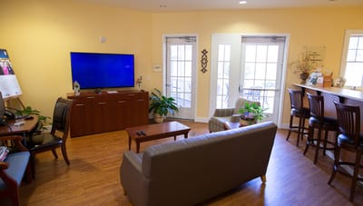 Interior lounge area with seating and TV