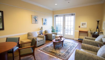 Bright common area with seating and a table