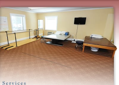 Therapy room with exercise equipment and seating