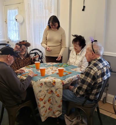 Residents participating in a group activity at a table
