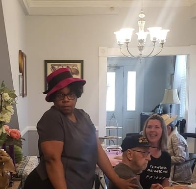 Residents and staff engaging in a lively moment in a common area