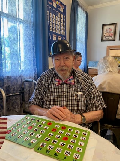 Resident playing bingo in a common area