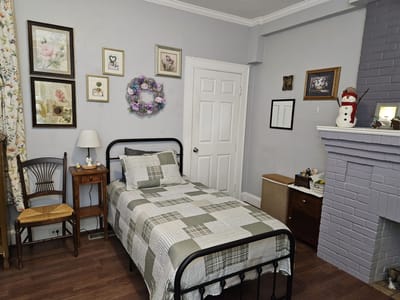 Cozy resident room with a bed and decorative wall art
