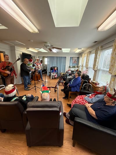 Residents enjoying a live music performance in a common area