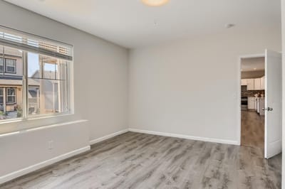 Bright, empty interior room with a large window