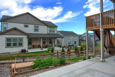 Exterior view of a senior living facility with gardens