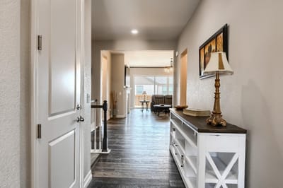 Interior view of a hallway leading to a seating area