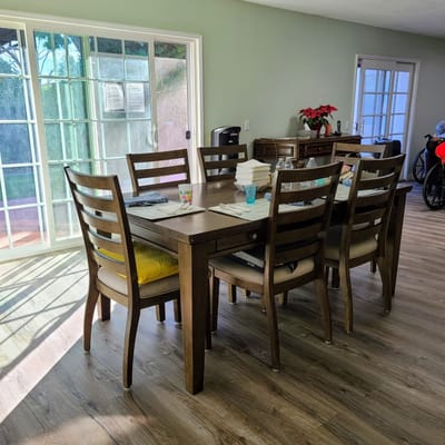Bright dining area with a wooden table and chairs