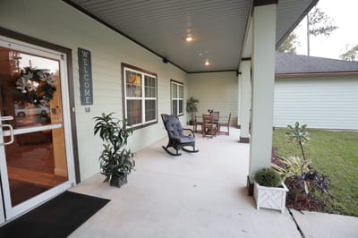 Welcoming entrance with seating and plants