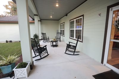 Outdoor seating area with rocking chairs