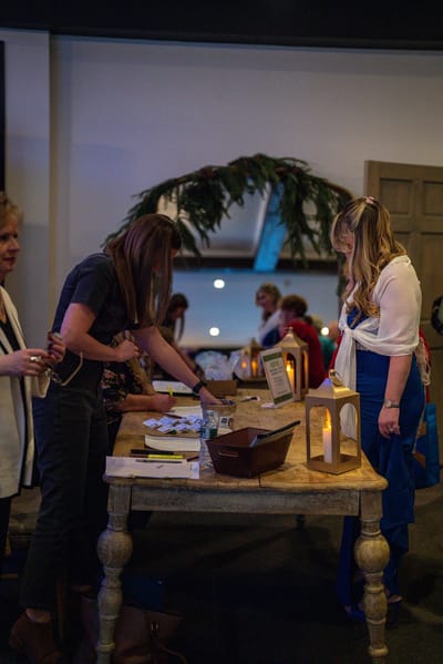 People at a registration table during an event