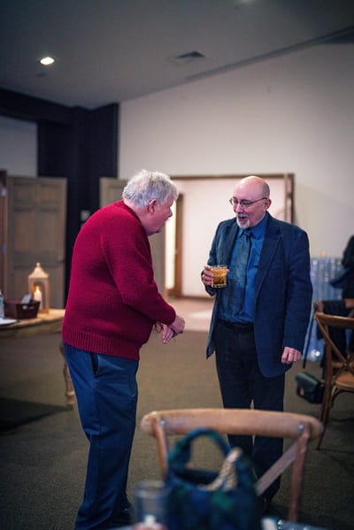 Two men chatting in a common area