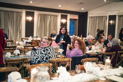 Guests enjoying a catered event in a dining area