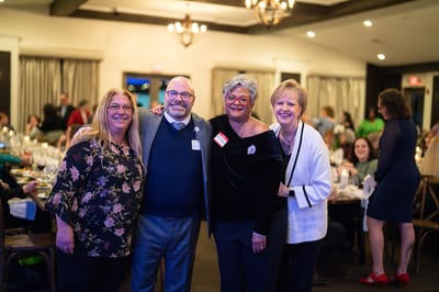 Group of staff members posing in a facility event
