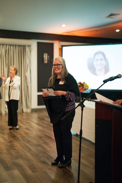 Staff member presenting at a community event