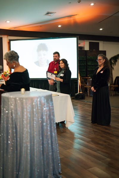 Staff members presenting at a facility event