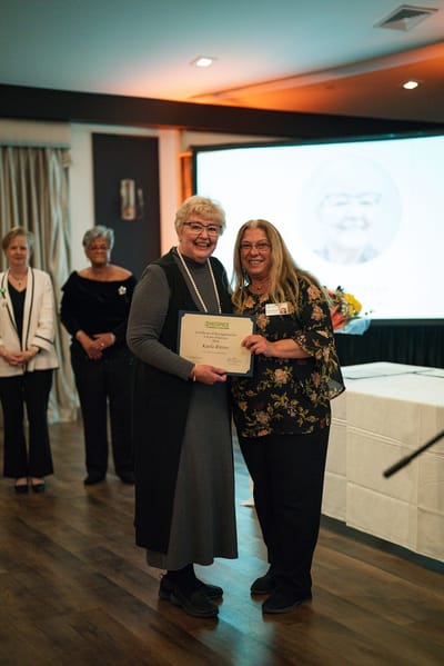 Residents celebrating an achievement at an event