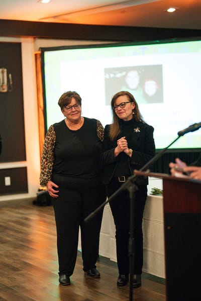 Two women at an awards ceremony