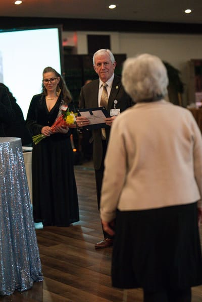 Residents and staff engaged in a celebration event