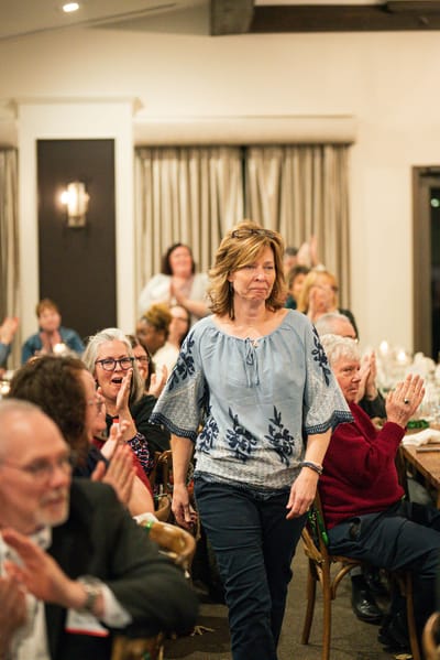 Guests applauding at a celebration event