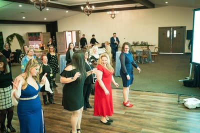 Residents and staff dancing at a facility event