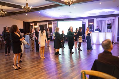 Residents participating in a lively dance event in the common area