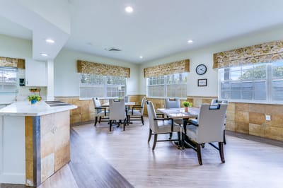 Bright dining area with tables and chairs