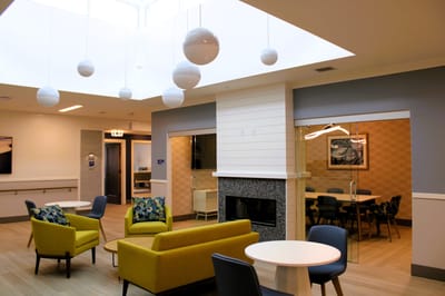 Bright common area with modern seating and decor