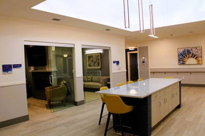 Bright common area with seating and large countertop