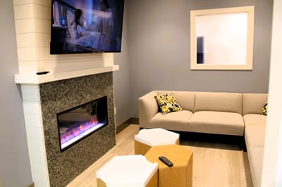 Cozy common area with modern furnishings and a TV