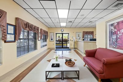 Bright common area with seating and floral decor