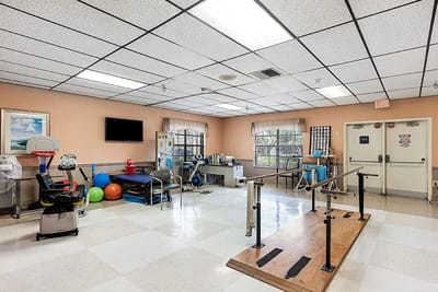 Therapy room with exercise equipment and therapy bars