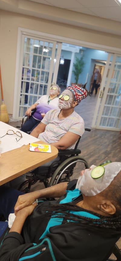 Residents enjoying a spa day with cucumber slices