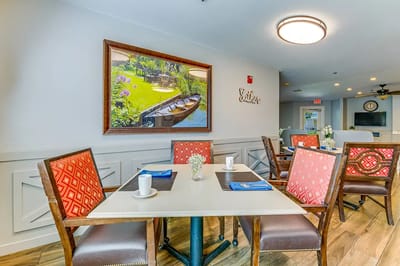Dining area with tables and decorative artwork