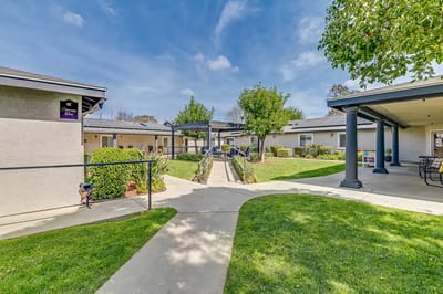 Well-maintained outdoor courtyard with pathways and greenery