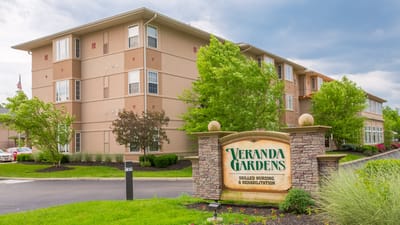 Exterior view of Veranda Gardens facility with signage