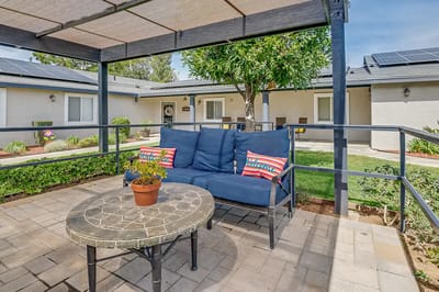 Outdoor seating area with a table and chairs