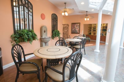 Bright common area with tables and decor