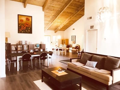 Bright common area with natural wood ceiling