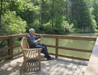 Resident sitting peacefully by a pond
