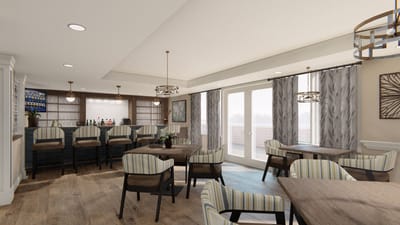 Bright and modern lounge area with seating and bar